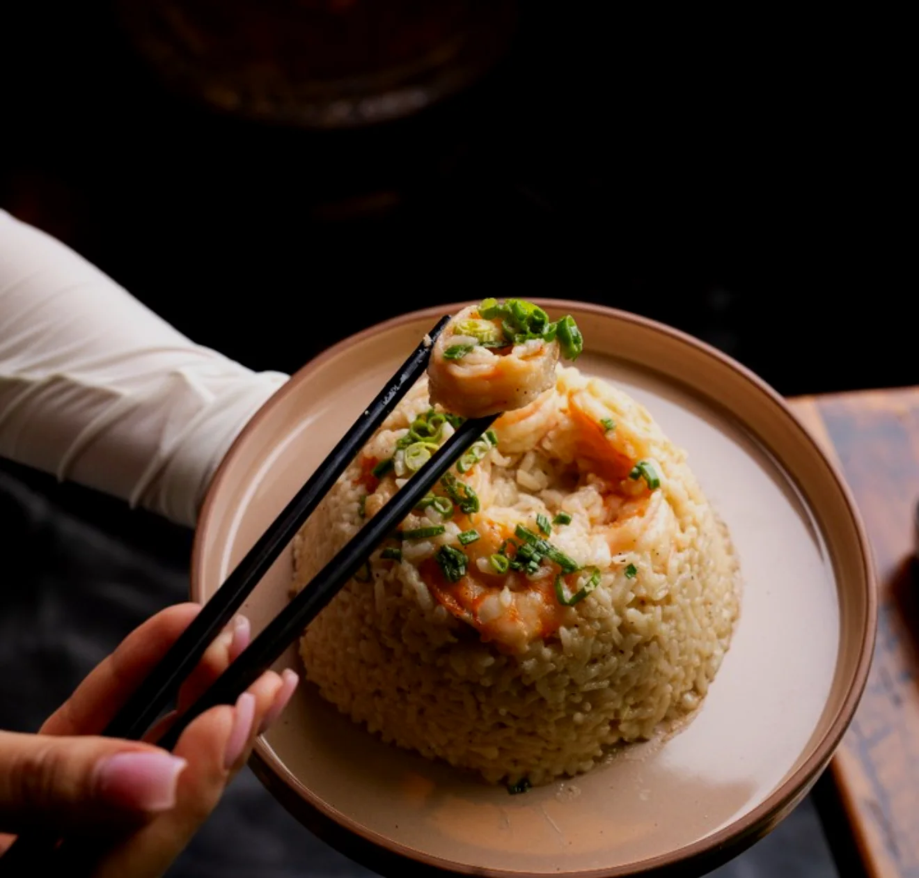 Shrimp fried rice served on a stoneware plate