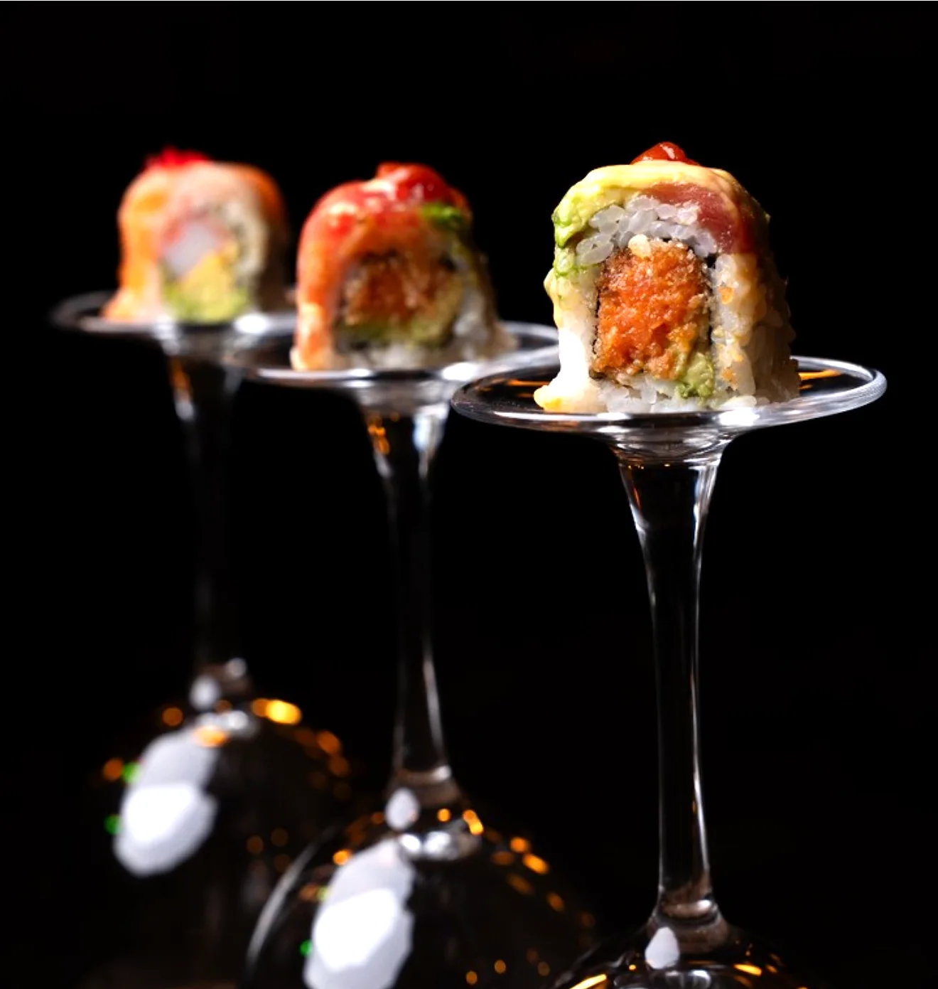 Signature rolls balanced on inverted wine glasses